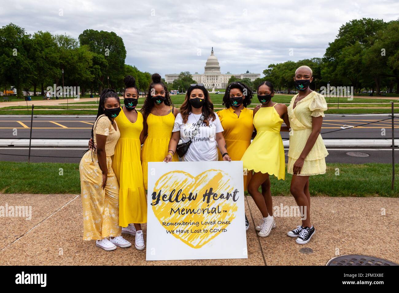 Washington, DC, USA, 5 May, 2021.  Pictured: Rosie Davis, who created the Yellow Heart Memorial after losing her mother to Covid-19, witha dance group affiliated with All Hail the Creatives, at a rally to pressure the United States Government to waive patent protections for the Covid-19 vaccine and make it easily accessible to the rest of the world.  14 organizations joined to host the rally, recognizing that worldwide immunity is in everyone’s best interest.  Credit: Allison C Bailey / Alamy Live News Stock Photo