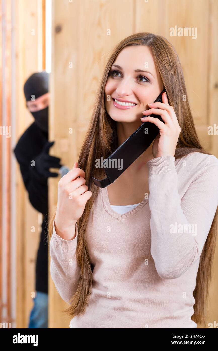 Security disguised burglar breaking in an apartment or office and