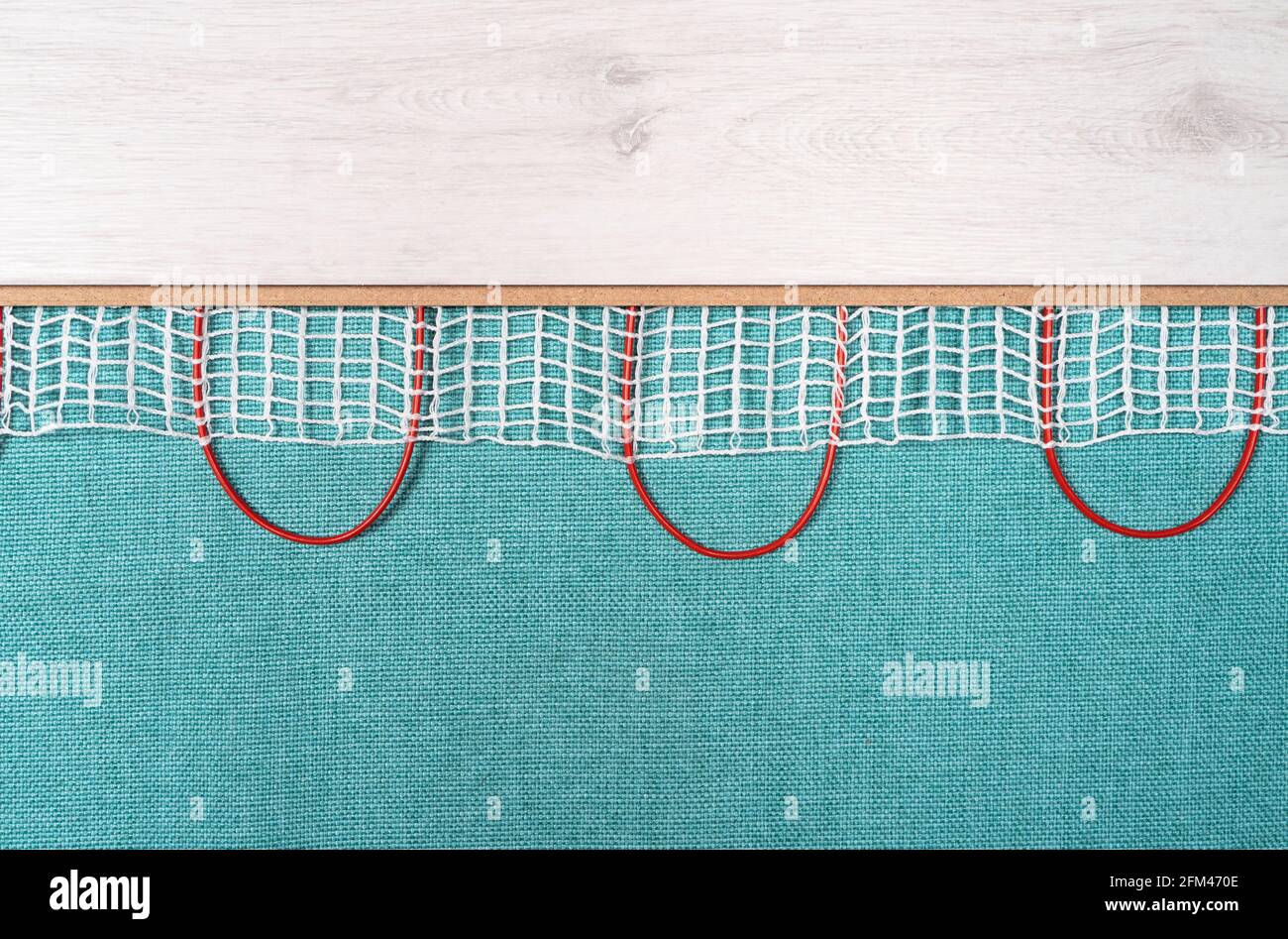 Heated floor under laminate background. Underfloor electric heating