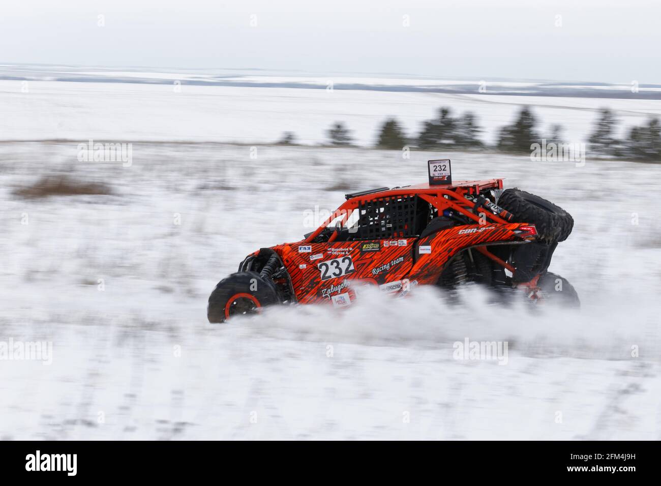 Ulyanovsk Russia December 09 2017. Rally raid Hills of Russia 4WD buggy rushes on the snow covered road among fields and hills Stock Photo Alamy