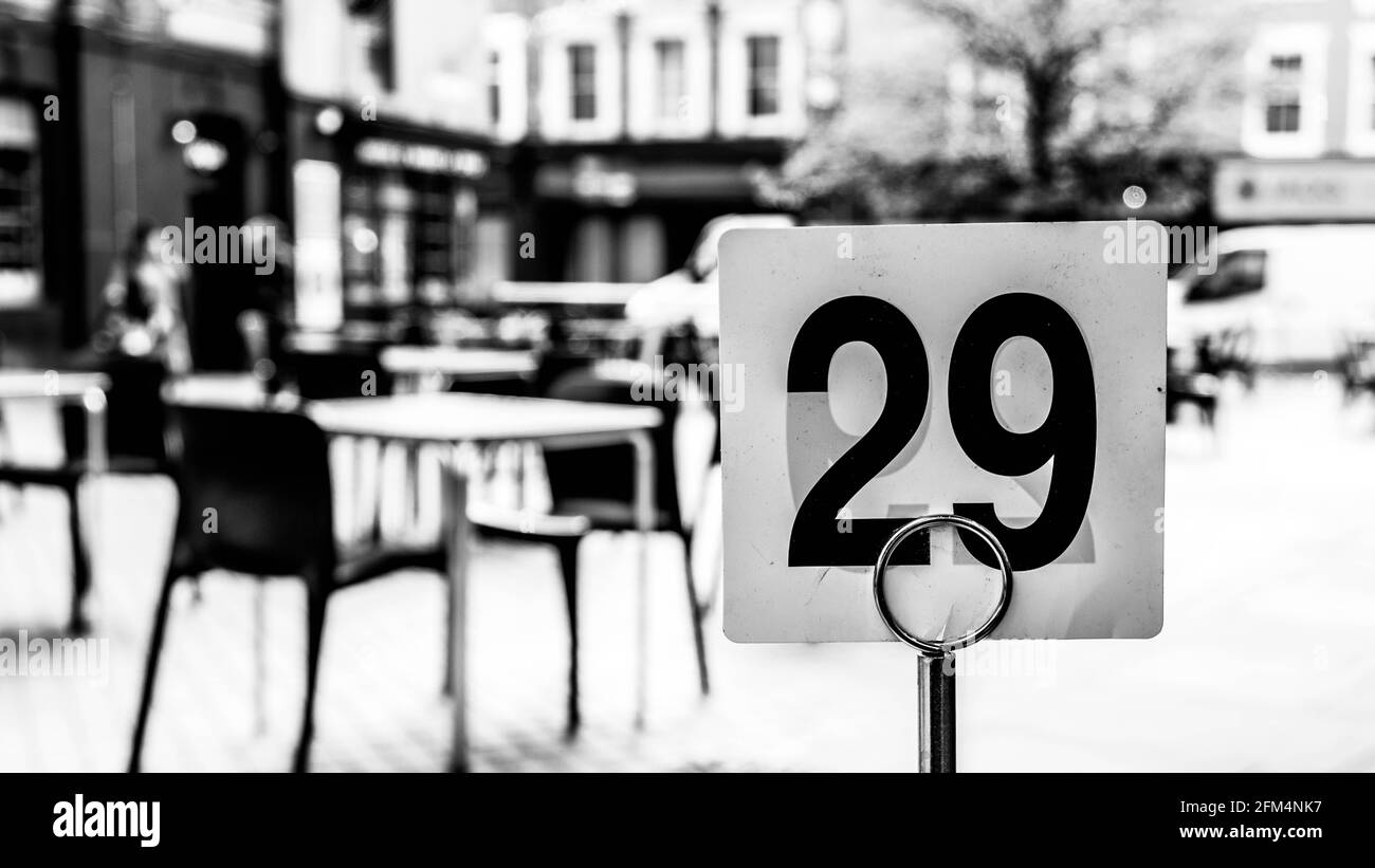 Kingston Upon Thames London UK, May 04 2021, Black and White Image Empty Outside Pub Or Cafe Seating Area Table And Chairs Stock Photo