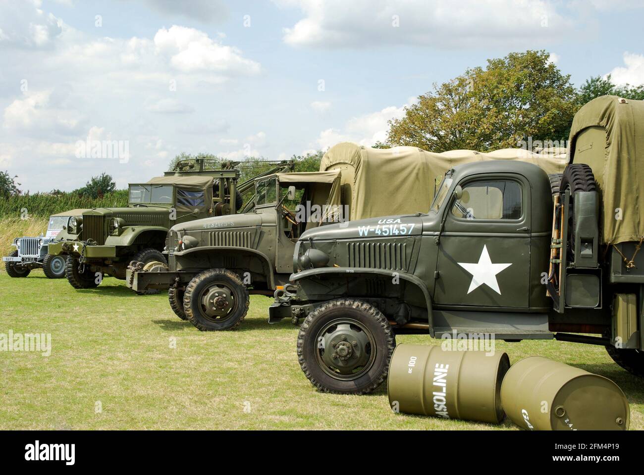 Row of Second World War American trucks at a re-enactment event at Damyns Hall, Essex, UK. US Army trucks and jeep Stock Photo