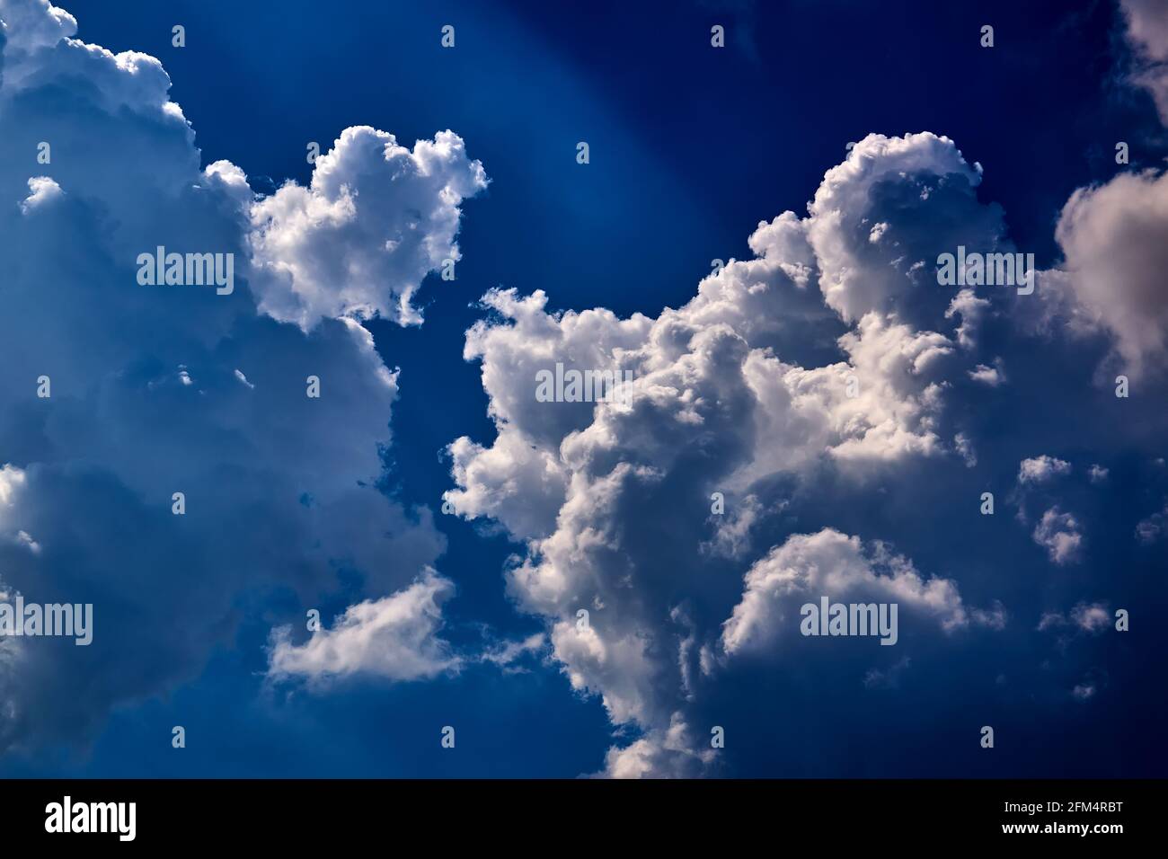 The blue sky with fluffy clouds Stock Photo - Alamy