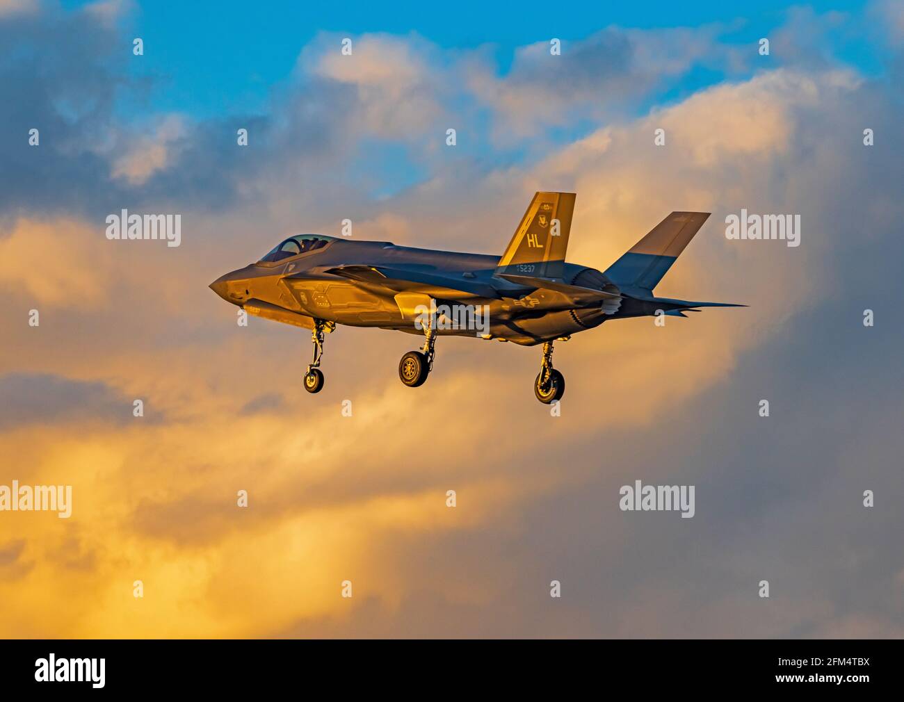 An F-35A Lightning II prepares to land in the golden light of the setting sun at Hill Air Force Base, Layton, Davis County, Utah; USA; Stock Photo