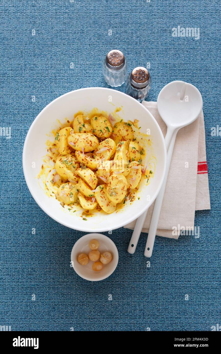 Potato salad with mayonnaise macadamia nuts mustard and tarragon Stock