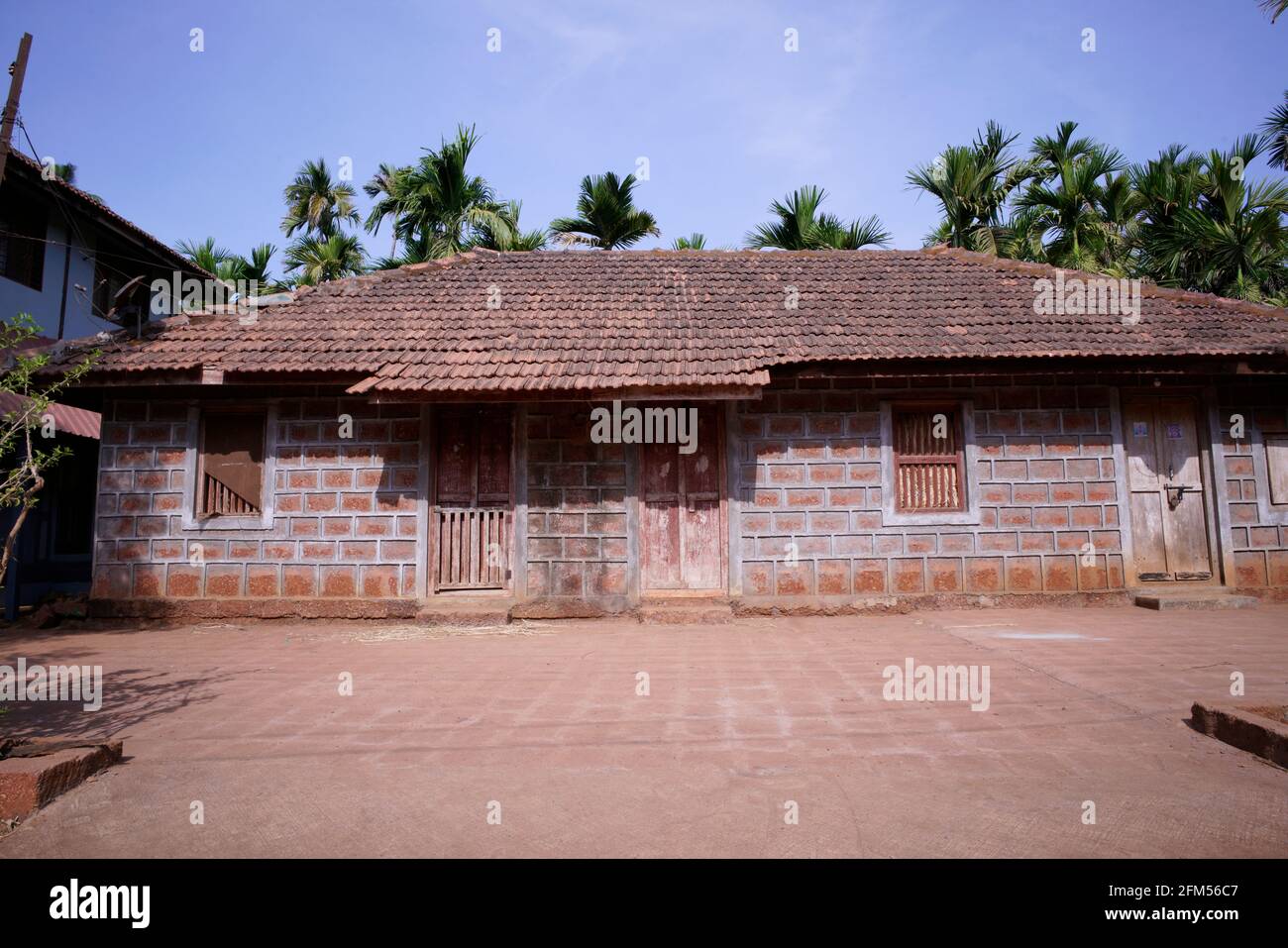 Typical traditional house with local stone and wood from Western coast of India Stock Photo