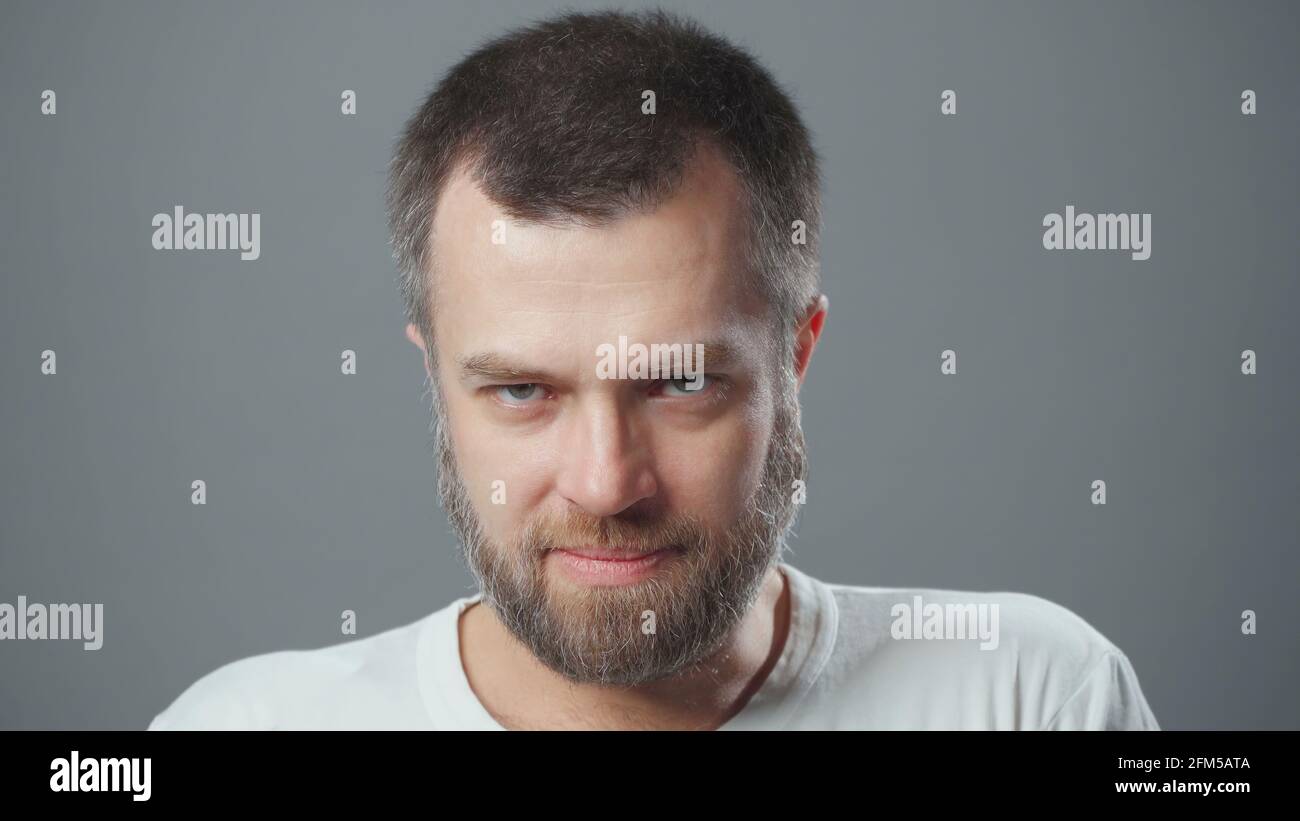 Angry young bearded man hi-res stock photography and images - Alamy
