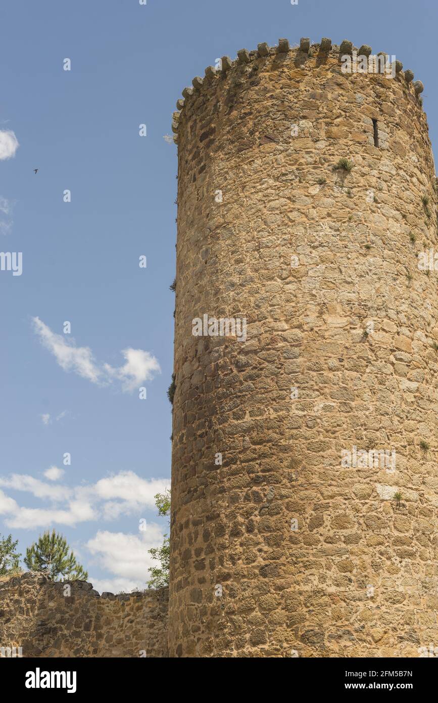 Vertical shot of the tower of Barco Avila Castilla la Mancha in Spain under a cloudy sky Stock Photo