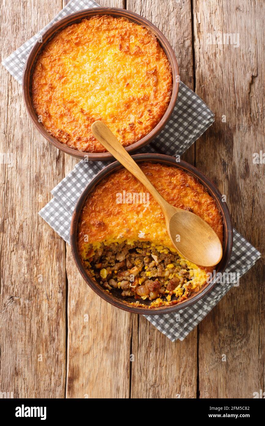 Corn and Beef Chilean Pastel de Choclo closeup in the bowl on the table. Vertical top view from above Stock Photo