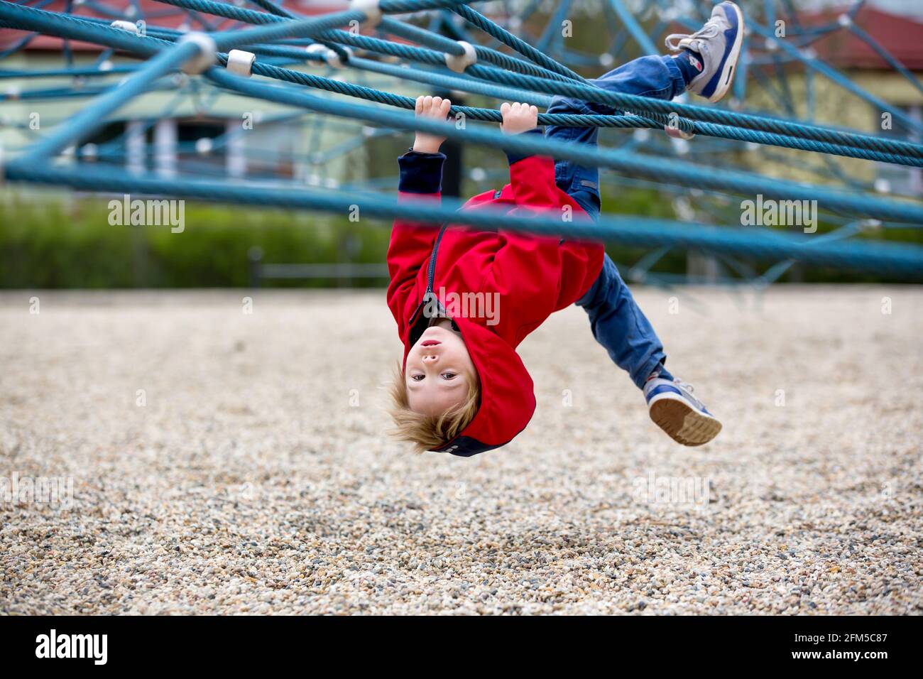 Cute toddler boy, playing on the playground springtime Stock Photo - Alamy