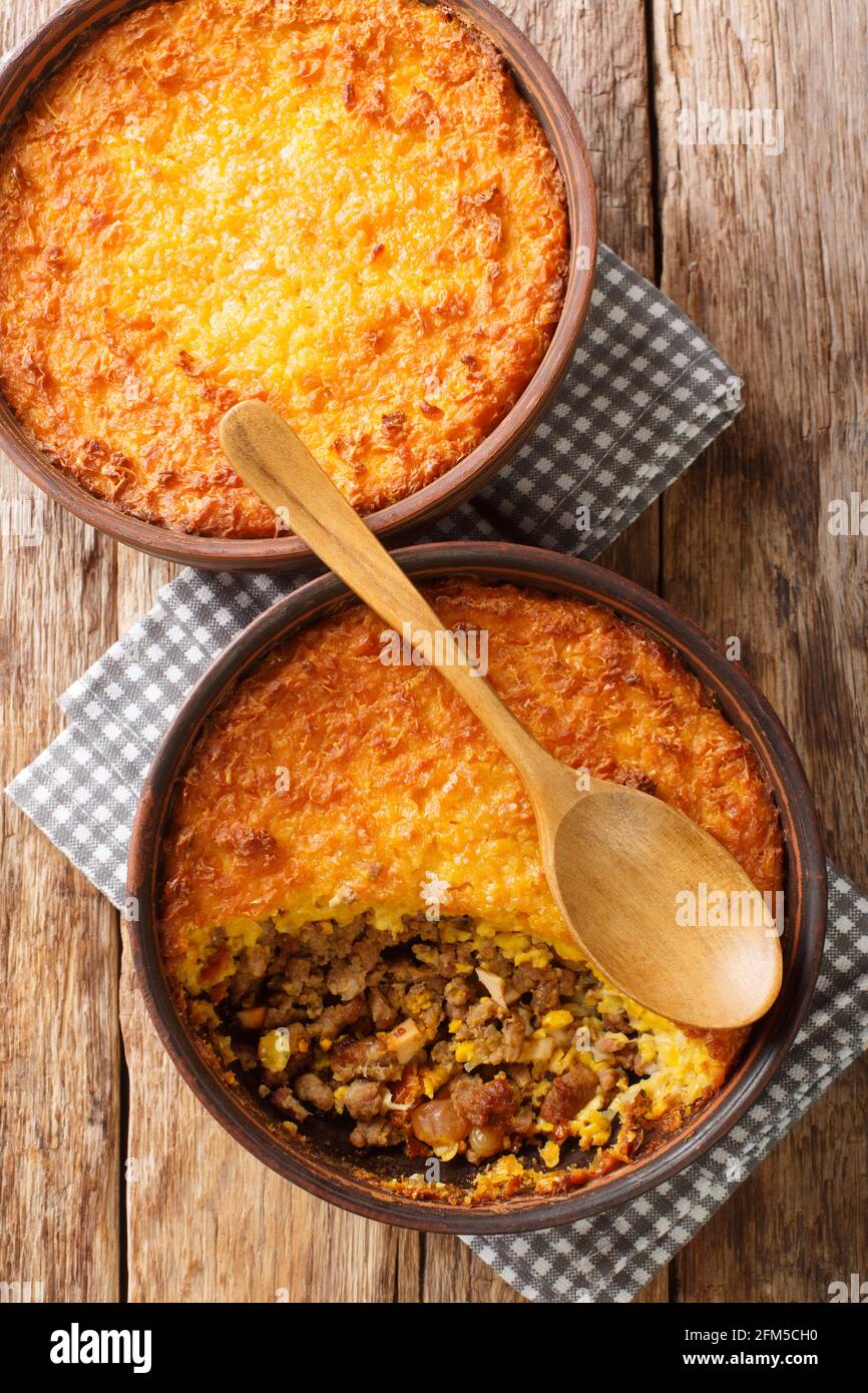 Pastel de Choclo Chilean Beef and Corn Casserole closeup in the bowl on the table. Vertical top view from above Stock Photo