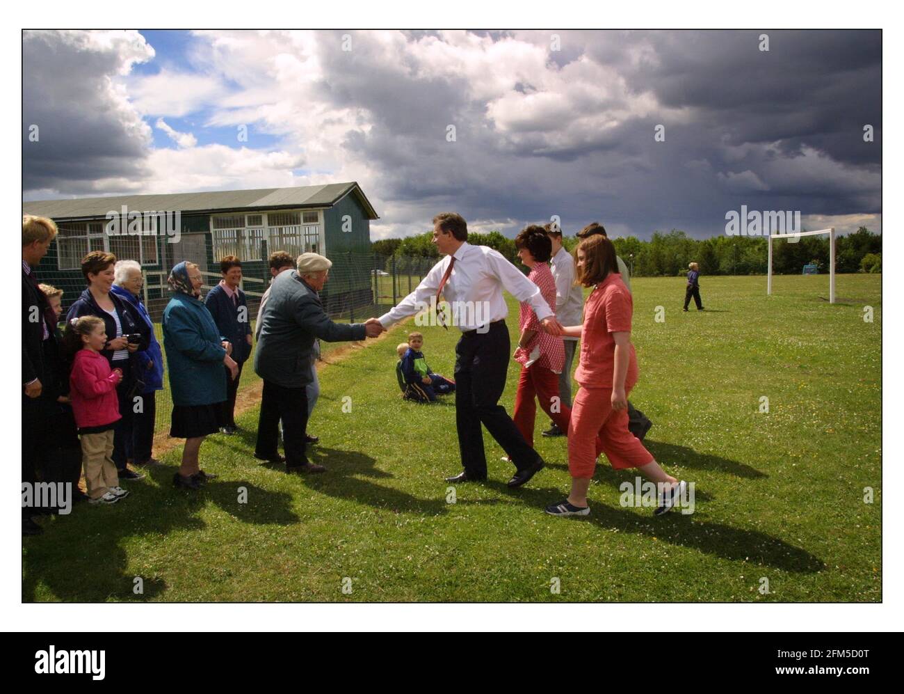 The General Election June 2001  Tony Blair and his family walk the short 200 yards across a football field to the polling booth in Trimdon near Sedgefield where he and Cherrie voted today. Children are Euan, Nicky and Kathryn 7/6/2001 Stock Photo