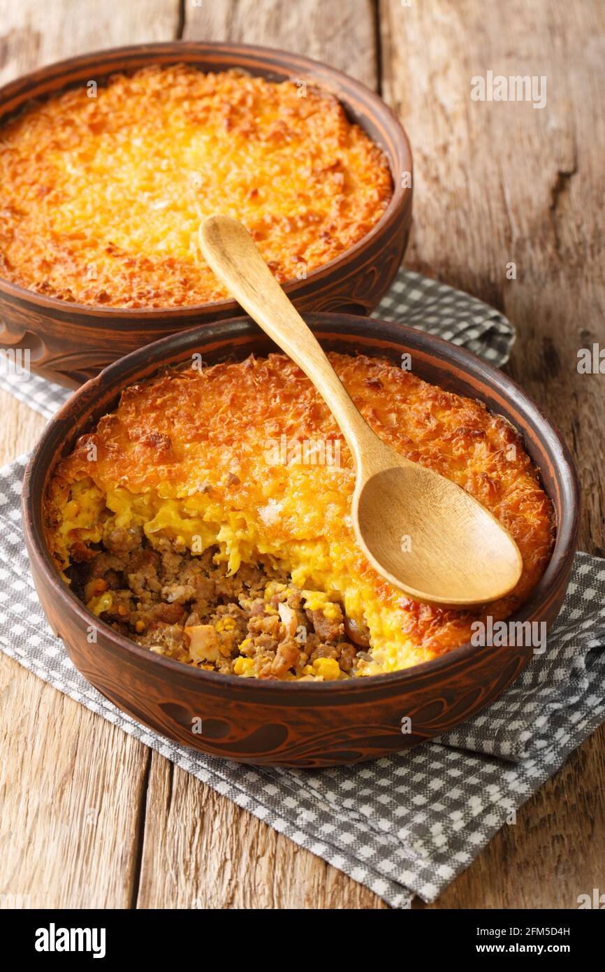 Corn and Beef Chilean Pastel de Choclo closeup in the bowl on the table. Vertical Stock Photo