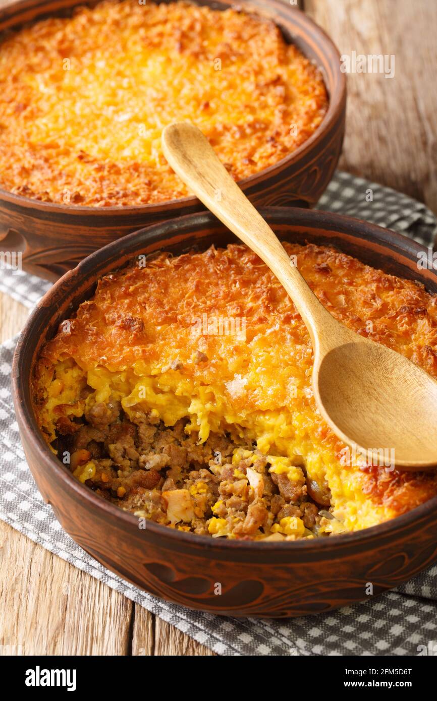 Pastel de Choclo Chilean Beef and Corn Casserole closeup in the bowl on the table. Vertical Stock Photo