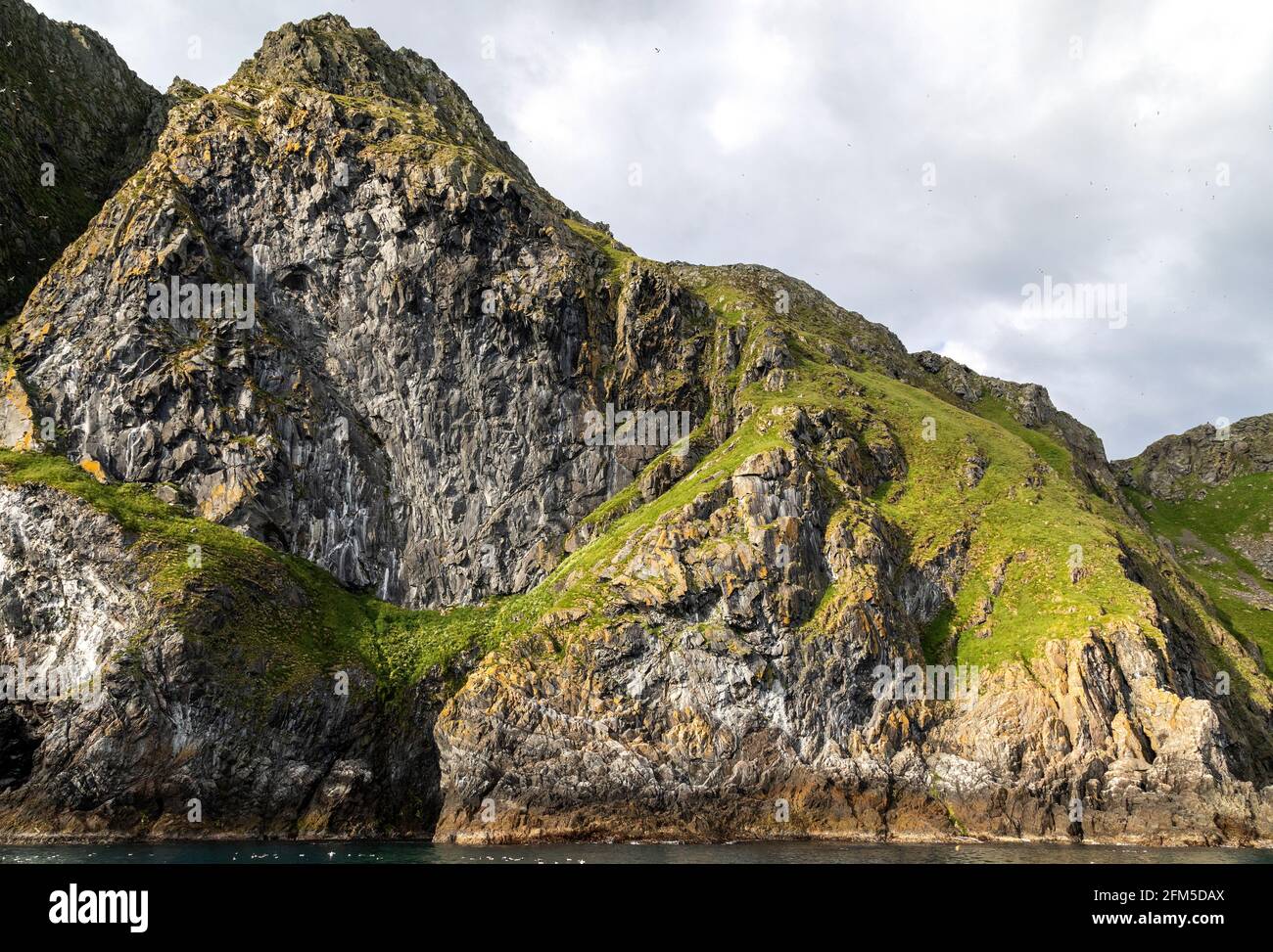 One of the steep cliffs at Runde bird island, west coast of Norway. Stock Photo