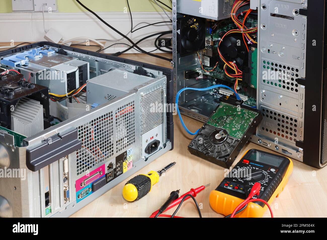 Open tower PC computers. Depicts computer repair, maintenance, service or upgrade in UK home Stock Photo