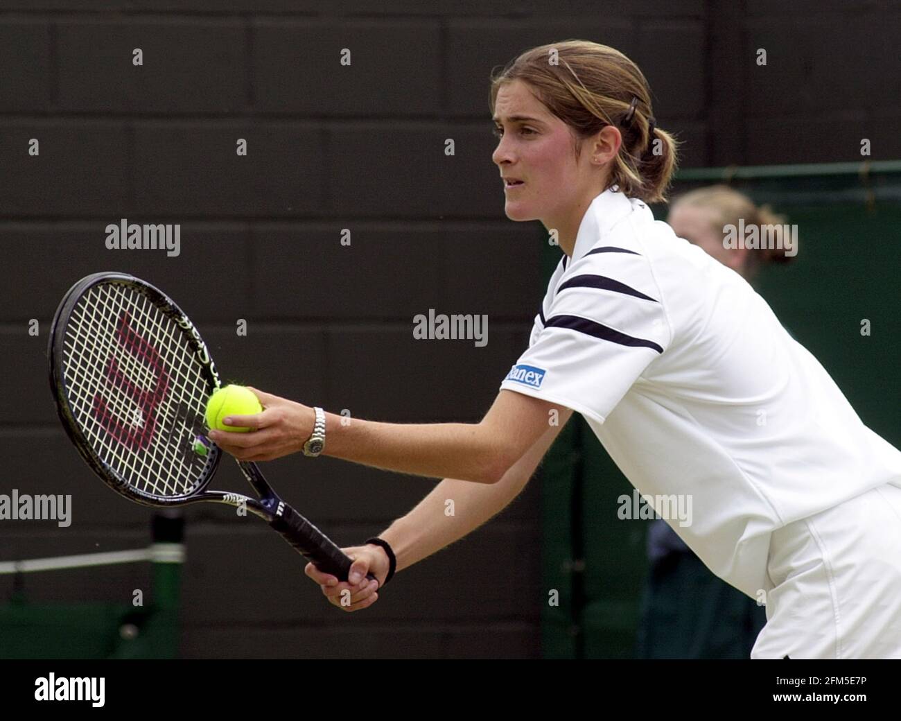 Hannah Collin of Great Britain on her way to victory against Ashley  Harkleroad of the USA during the second round of the girls singles in the  Wimbledon Lawn Tennis Championship at the