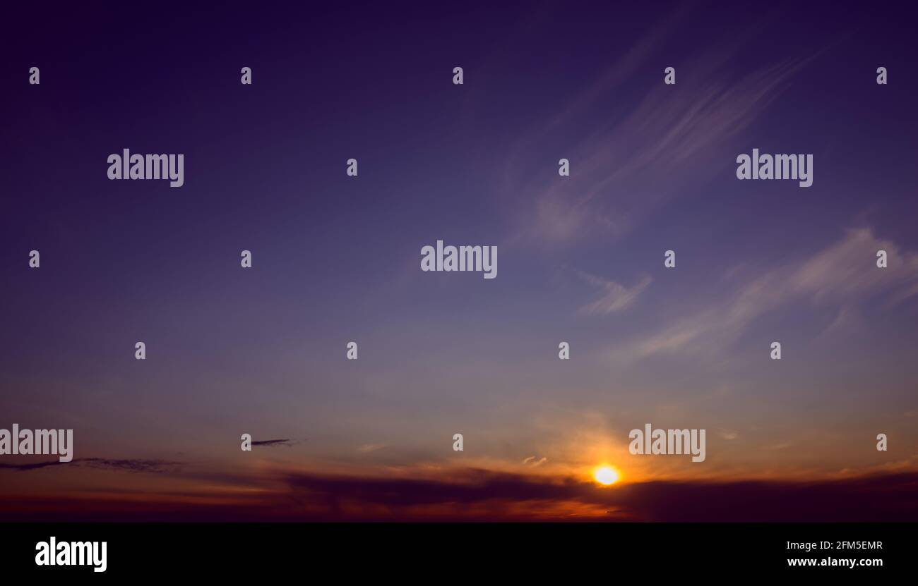 Beautiful colorful sunset sky with clouds and sunlight Stock Photo - Alamy