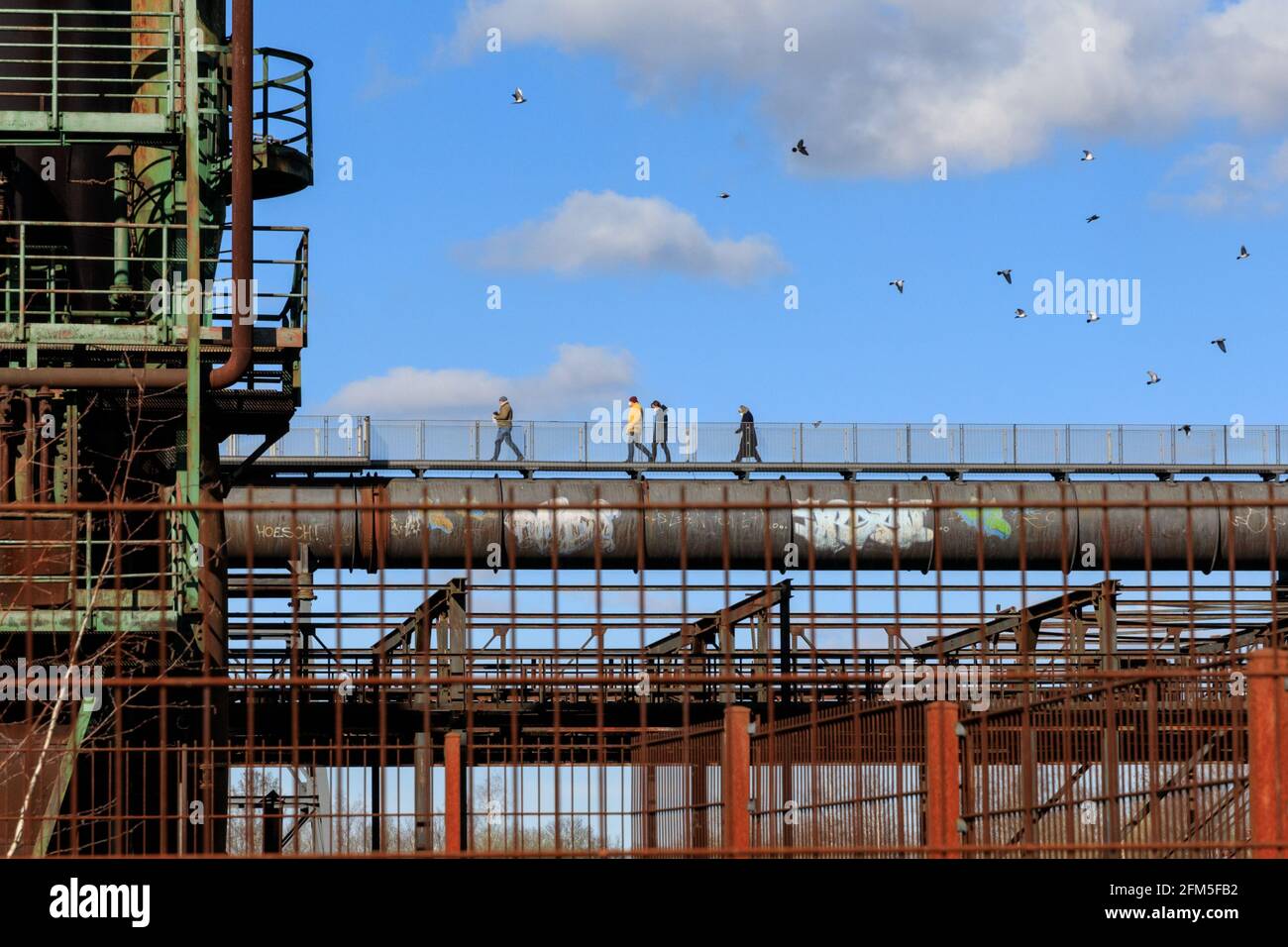 People walk on the Skywalk at the disused Phoenix West steelworks and blast furnace ironworks, formerly part of ThyssenKrupp in Dortmund, Germany Stock Photo