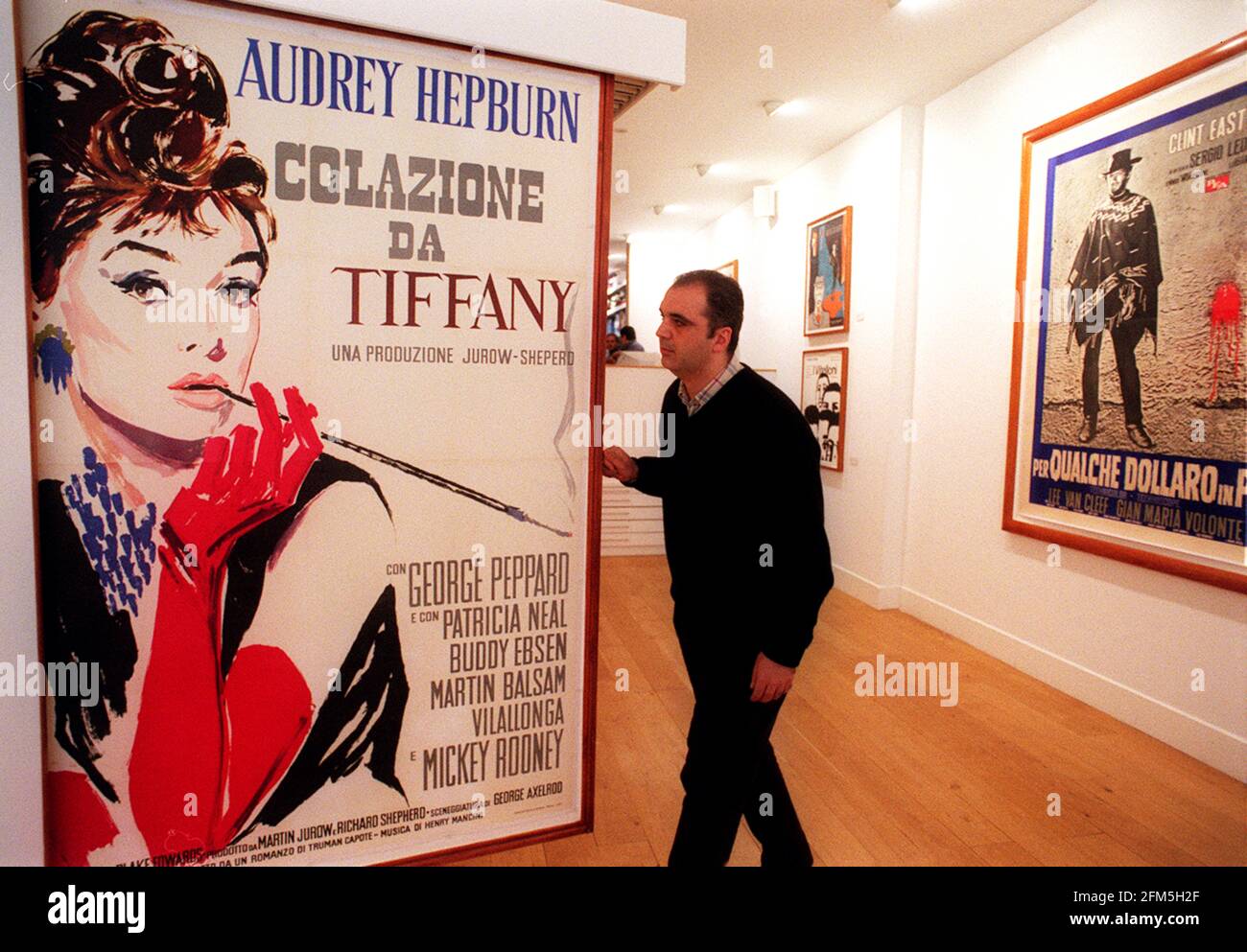 TONY NOURMAND, WITH FILM POSTERS IN THE REEL POSTER GALLERY IN NOTTING HILL. Stock Photo