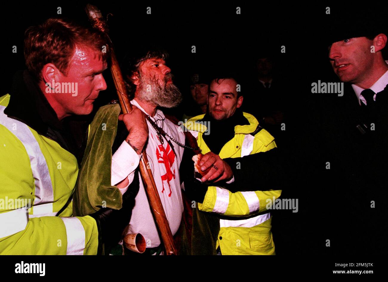 Arthur Pendragon June 1999 is evicted by police from the stones before the Summer Solstice. The official ceremony had to be cancelled due to disturbances erupting as non ticket  holders were evicted from the site prior to dawn Stock Photo