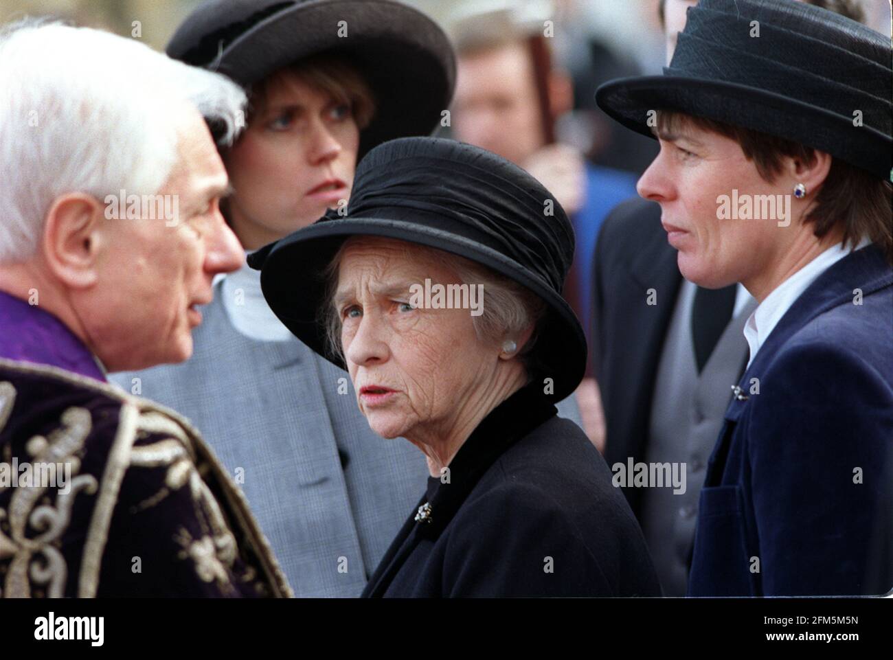 Pamela Powell widow of Enoch Powell February 1998 at his funeral with his daughters Jennifer and Susan right and Canon Donald Gray Stock Photo