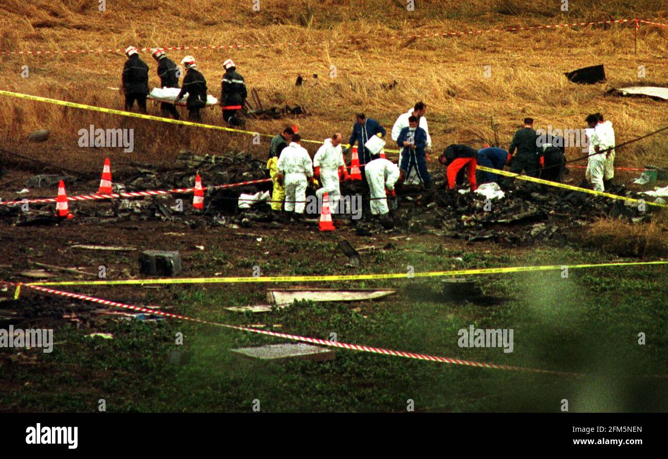 The Air France Concorde Crash scene near Charles De Gaulle Airport 2000  Firemen removing bodies from the crashed Air France Concorde  as crash investigators examine the wreckage of the plane after a fire developed in the wings and engines of the aircraft on take off Stock Photo
