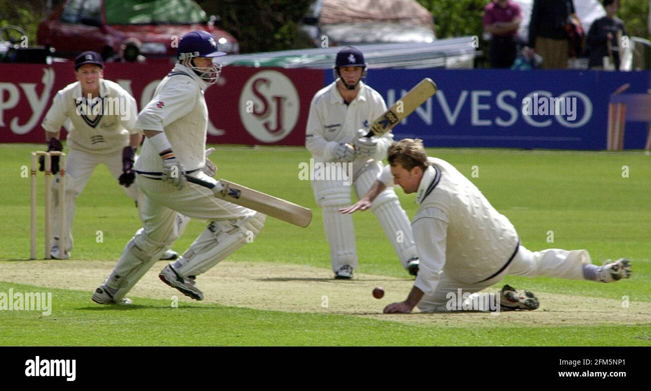 Phil Tufnell stops the ball from Nixon Aprill 2000 off his bowling Alan Wells Stock Photo