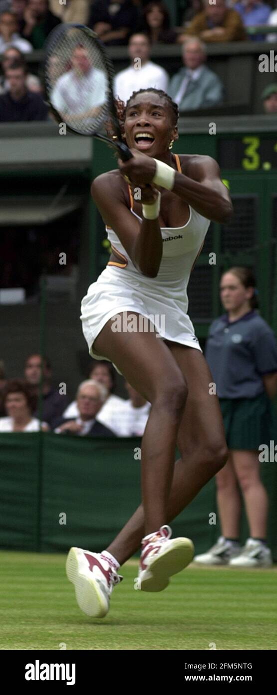 Venus Williams  in action against Martina Hingis July 2000 in their quarter final match at Wimbledon . Williams won  in three sets Stock Photo