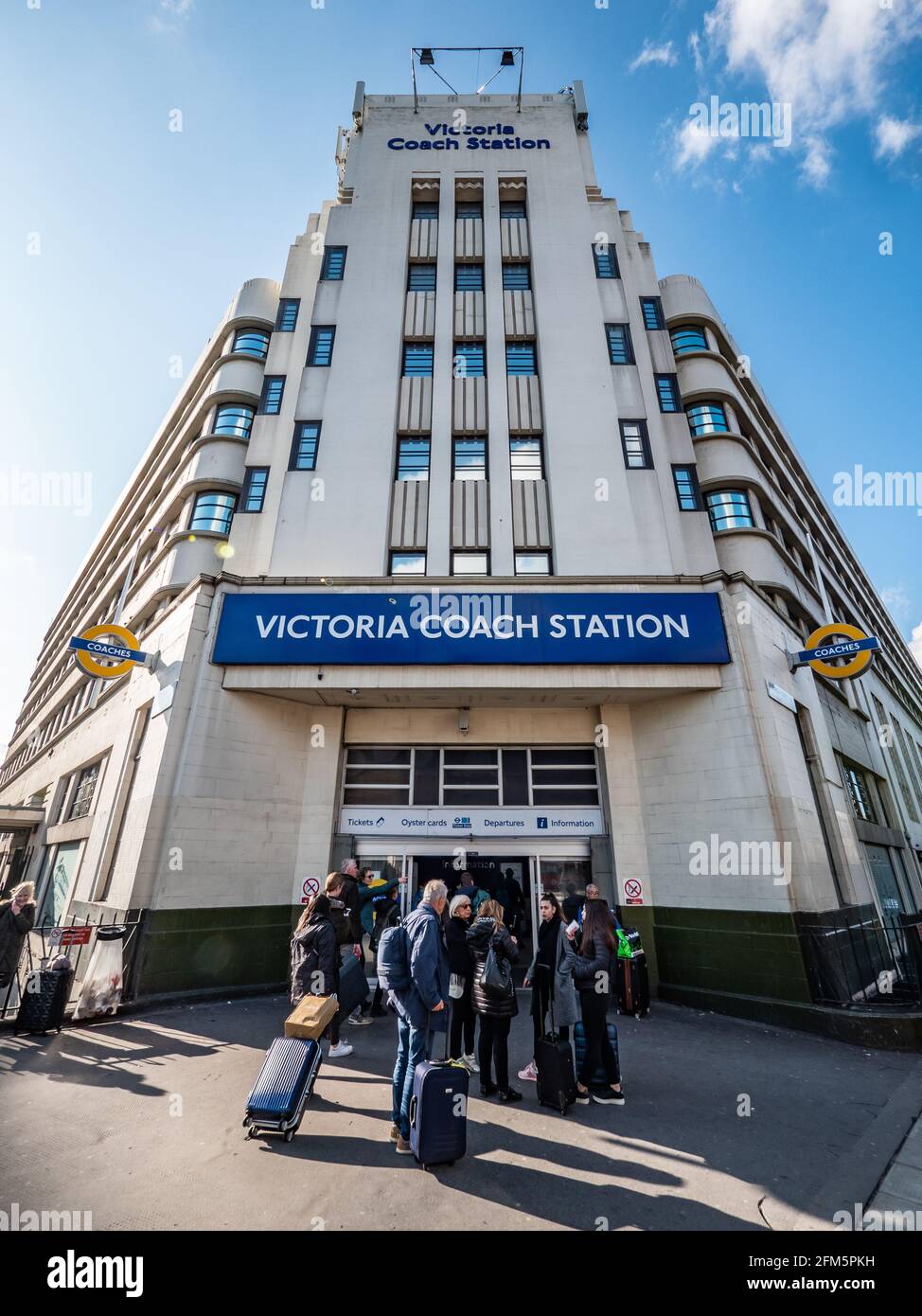 London Victoria Coach Station. Travellers arriving at the main entrance and 1930's Art Deco façade to London's largest bus terminal. Stock Photo