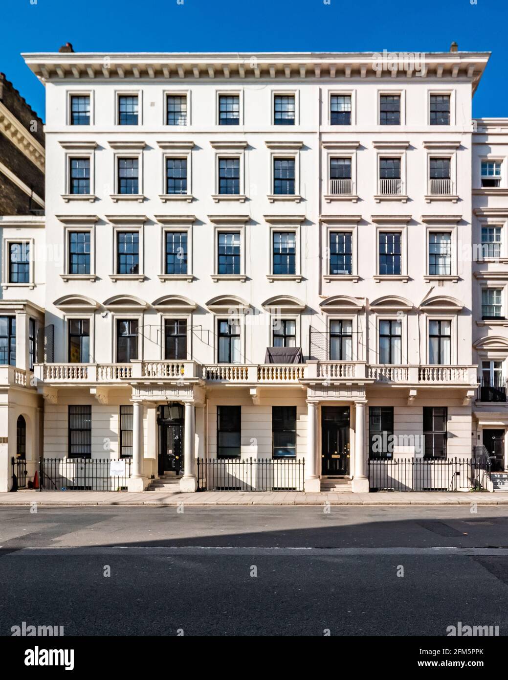 Georgian Townhouse, London. The façade to a grand town house building in the affluent Kensington district of West London. Stock Photo