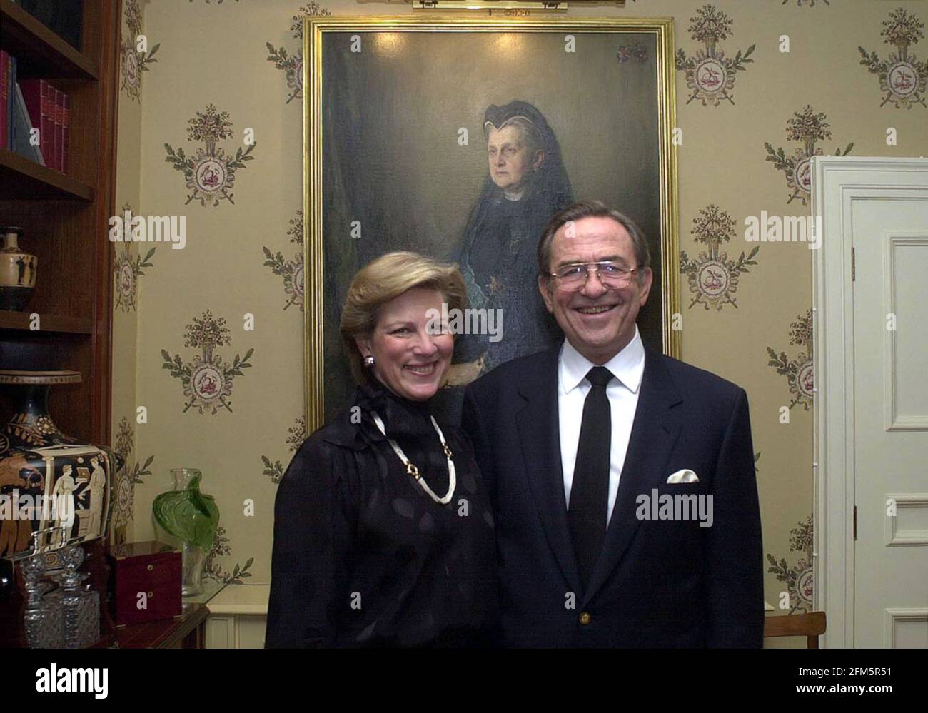 Ex-King Constantine of Greece, and his wife December 2000 Ex-Queen Anne-Marie, in their london home after today's court ruling. The portrait is his great grand-mother, Queen Olga. Stock Photo