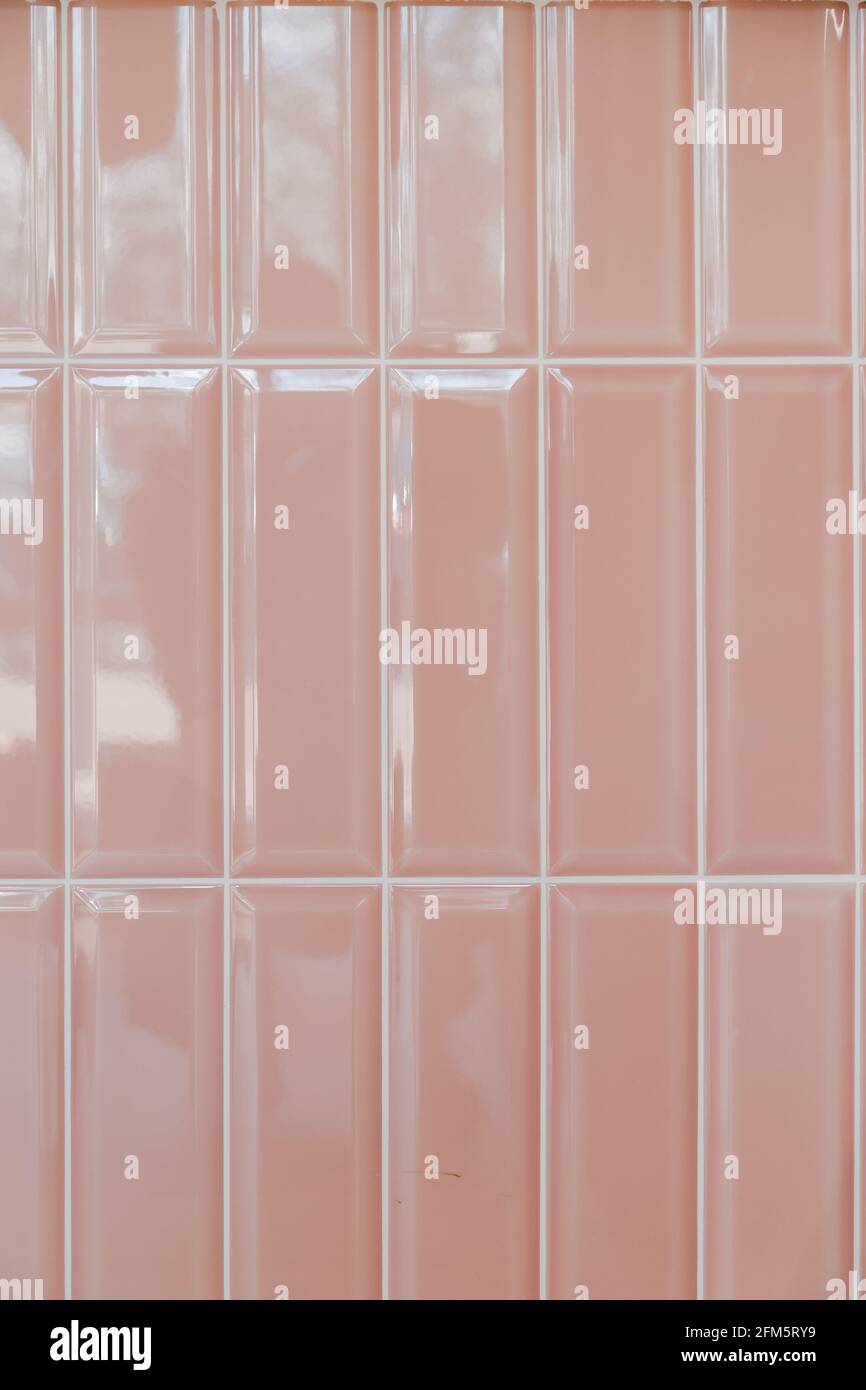 Pink glossy upright rectangular ceramic tile, background, texture Stock Photo