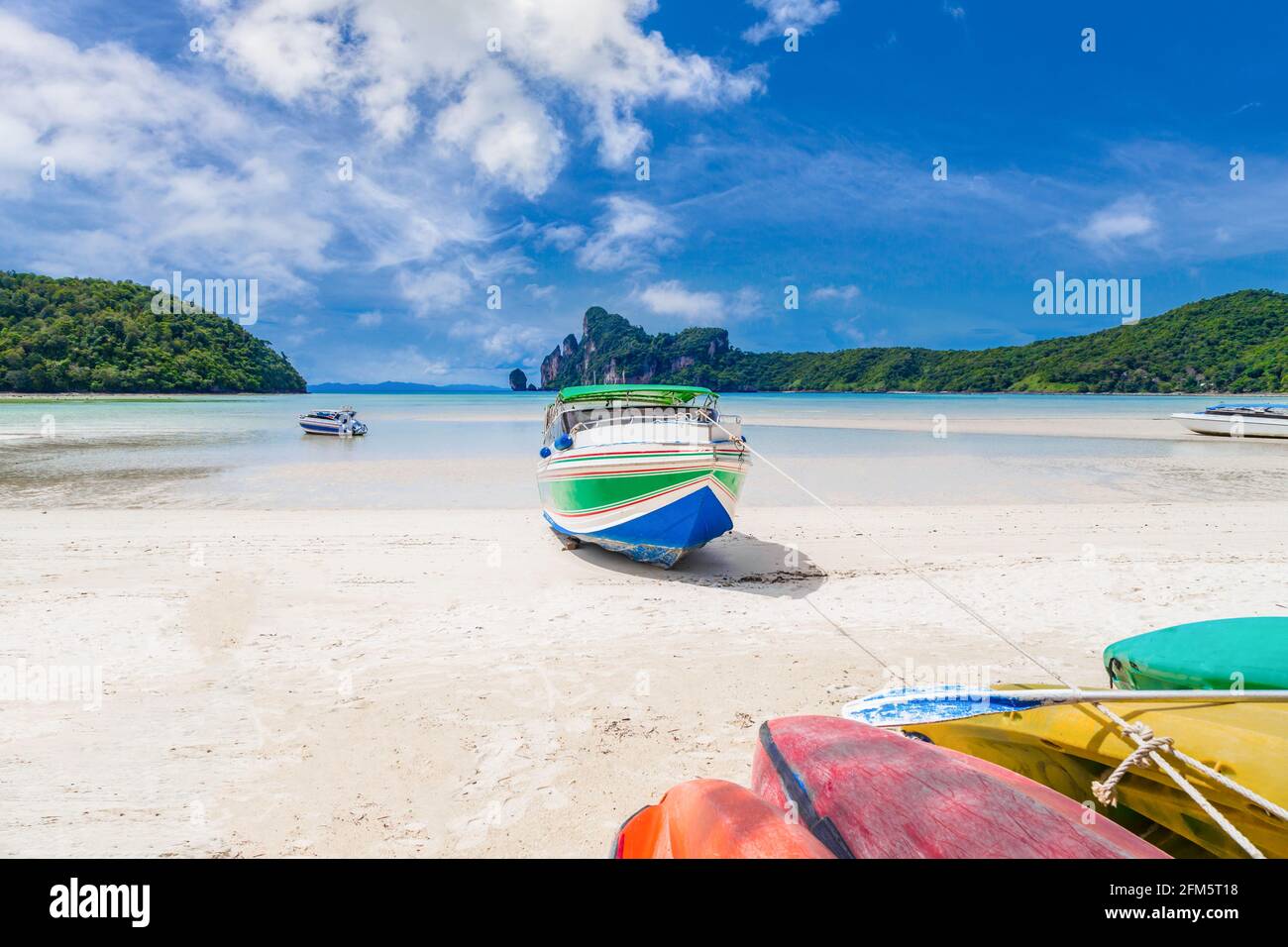 Landscape of speed boat in Phi phi island with blue sky background at Phuket, Thailand. Stock Photo