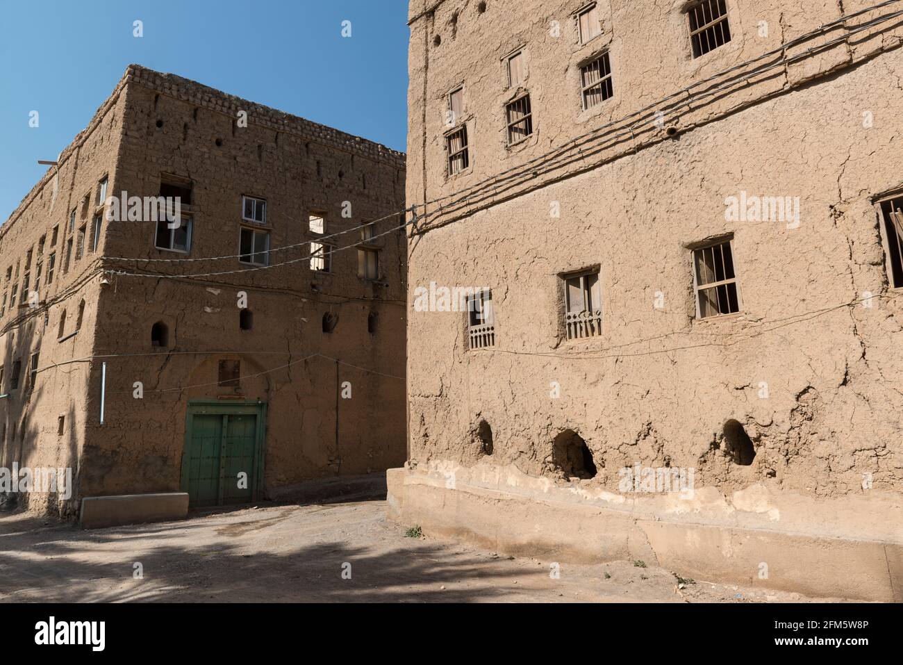 Old section with abandoned ruined houses in the town Al Hamra.  Ad Dakhiliyah Region, Oman. Stock Photo