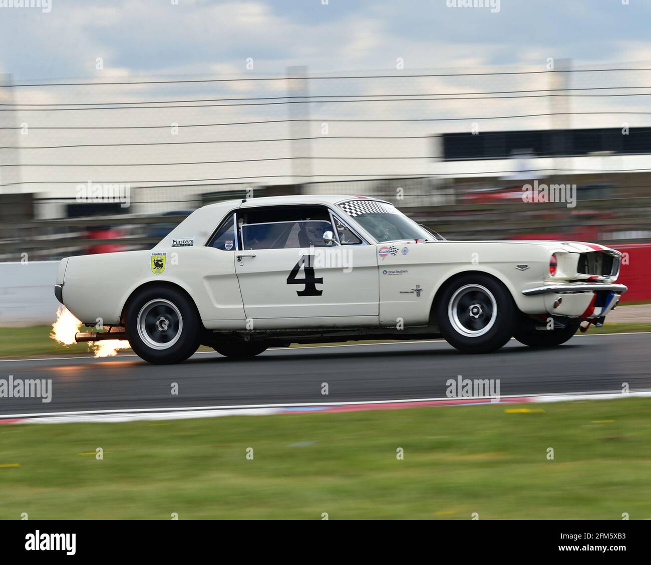 Spitting twin flames on entry to the Fogarty esses, Jon Miles, Dave Coyne, Mark Wright, Ford Mustang, RAC Pall Mall Cup for Pre-66 GT, Sports Racing a Stock Photo