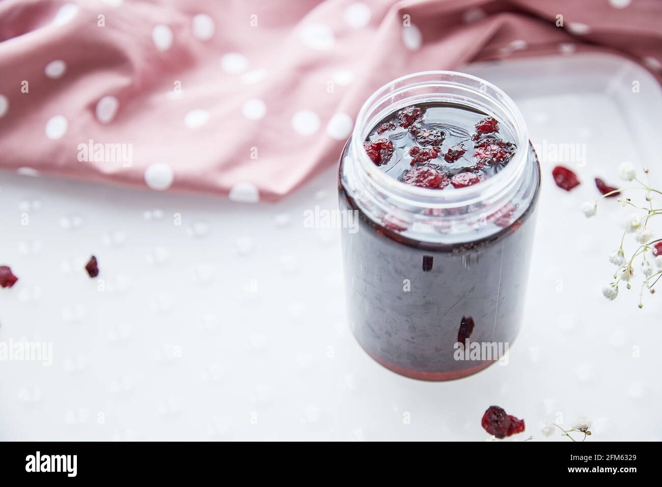 Healthy fermented honey product with cranberry, probiotics. Food preservative. Delicious recipe concept. Anti-viral food.  Stock Photo