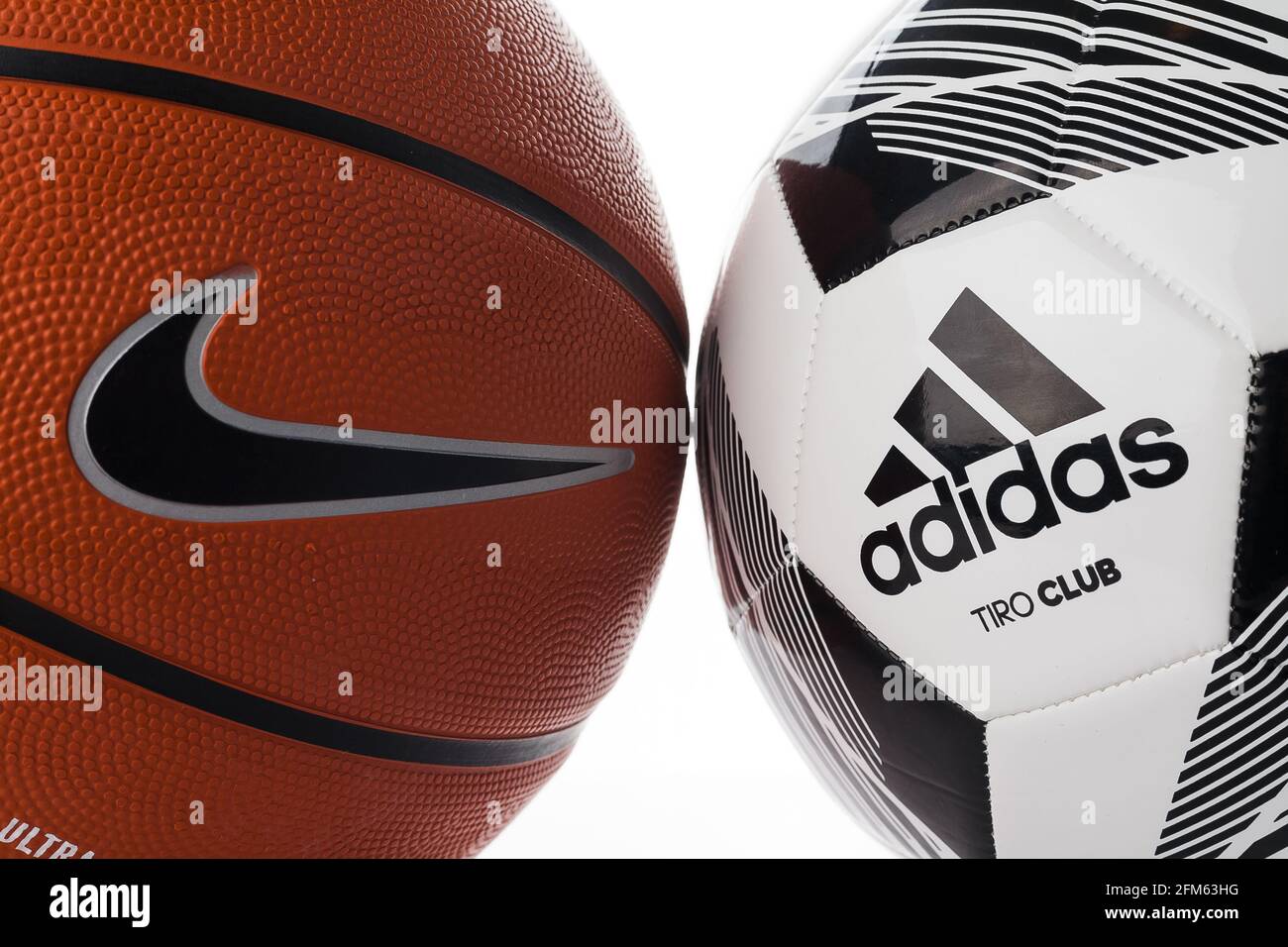 Adidas and Nike brand balls. Basketball and soccer balls on a white  background. Adidas football and Nike basketball Stock Photo - Alamy