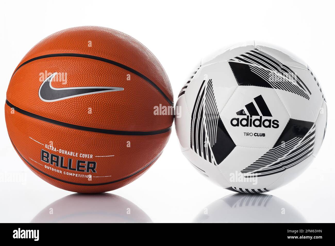 Adidas and Nike brand balls. Basketball and soccer balls on a white  background. Adidas football and Nike basketball Stock Photo - Alamy