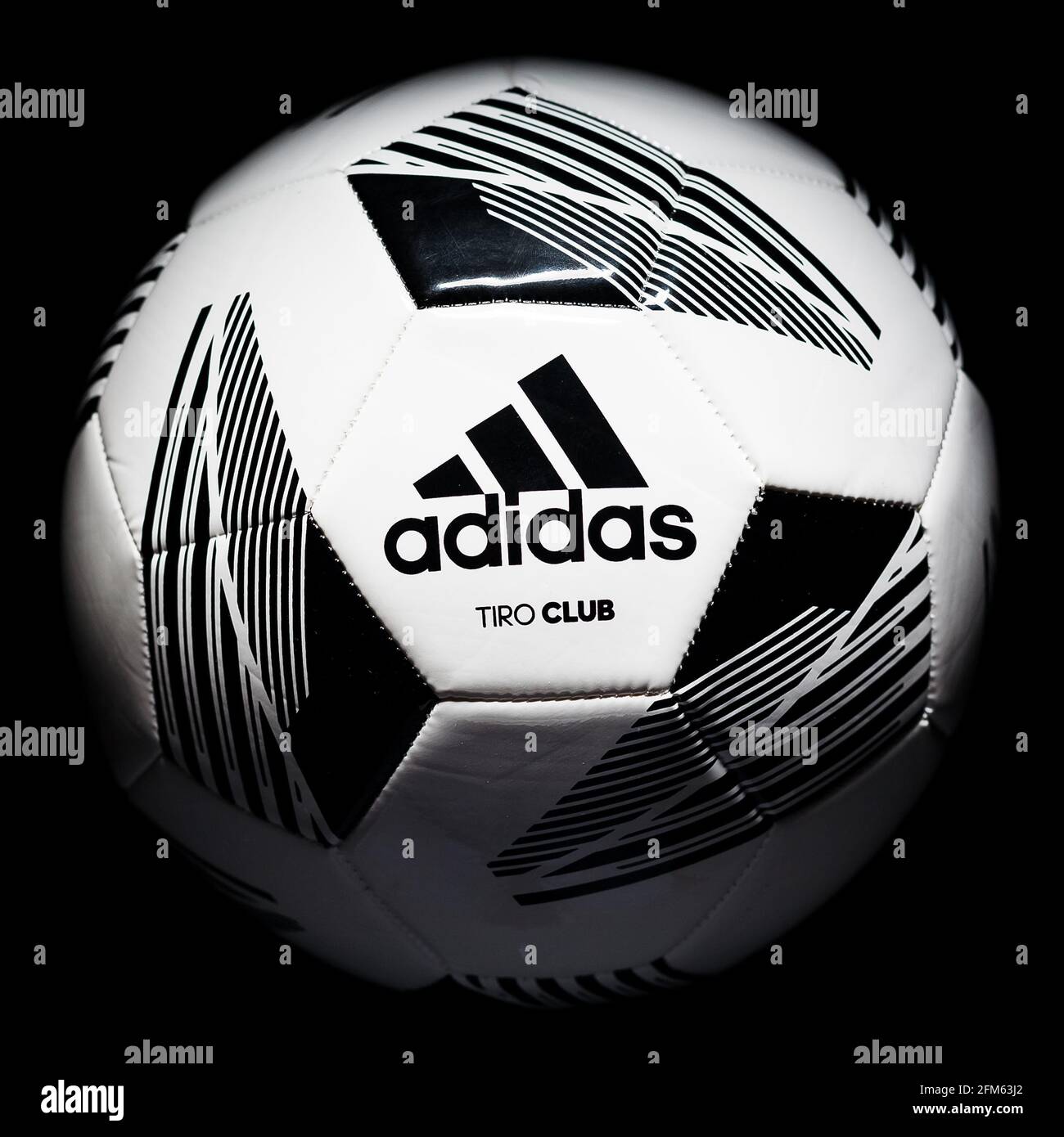 hogar pasillo ángulo Soccer, football ball Adidas Tiro Club on a black background. Adidas brand  logo Stock Photo - Alamy