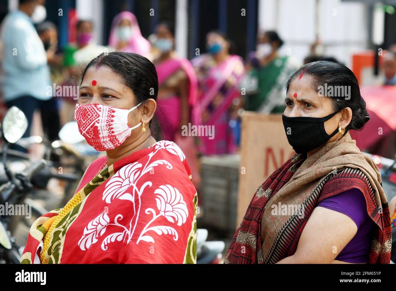 Assam, India. 6th May 2021. Indian citizens with mask cover standing in a long queue to get vaccinated to fight against COVID-19 at a vaccination centre at Bokakhat Sub-Division of Golaghat district. Credit: Majority World CIC/Alamy Live News Stock Photo