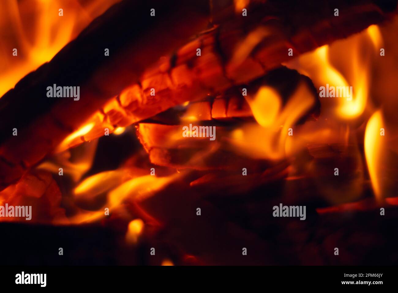 A fire burns in a fireplace, Fire to keep warm. Logs burning in a