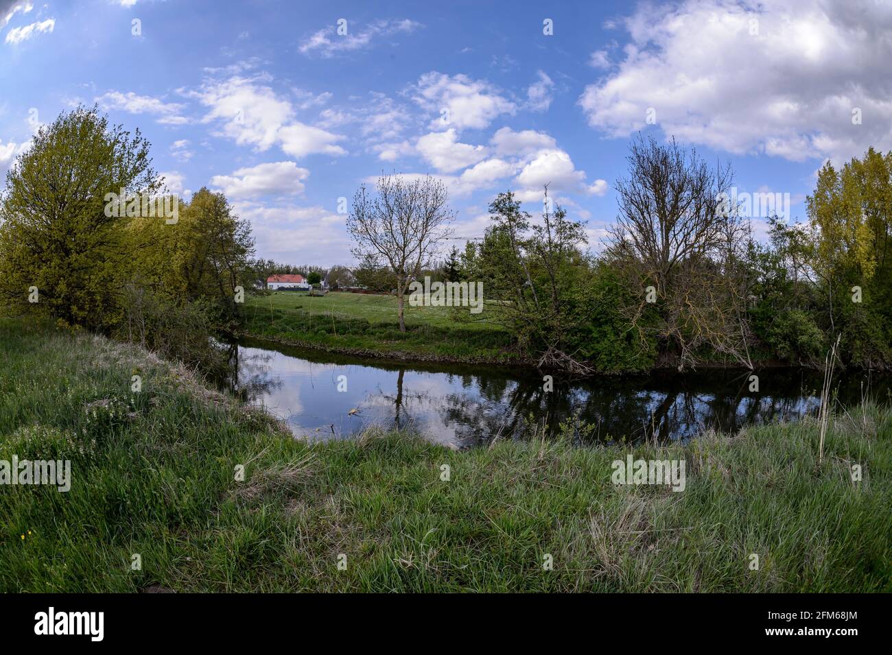 The river Zorn in the spring, Alsace, France. The river Zorn is a small tributary of the Rhine. The new leaves color the bucolic landsc Stock Photo