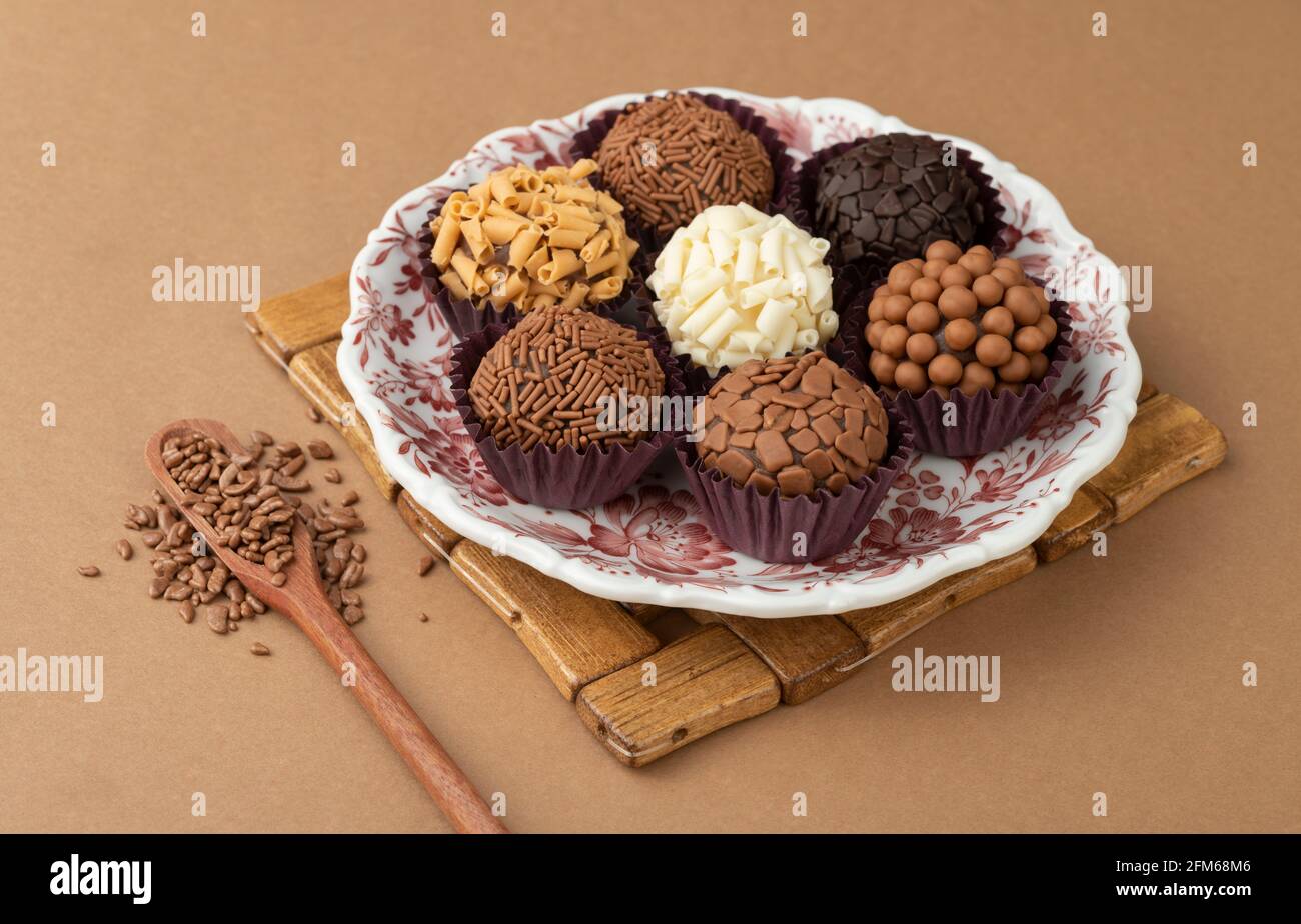 Typical brazilian brigadeiros on a plate with chocolate sprinkles Stock