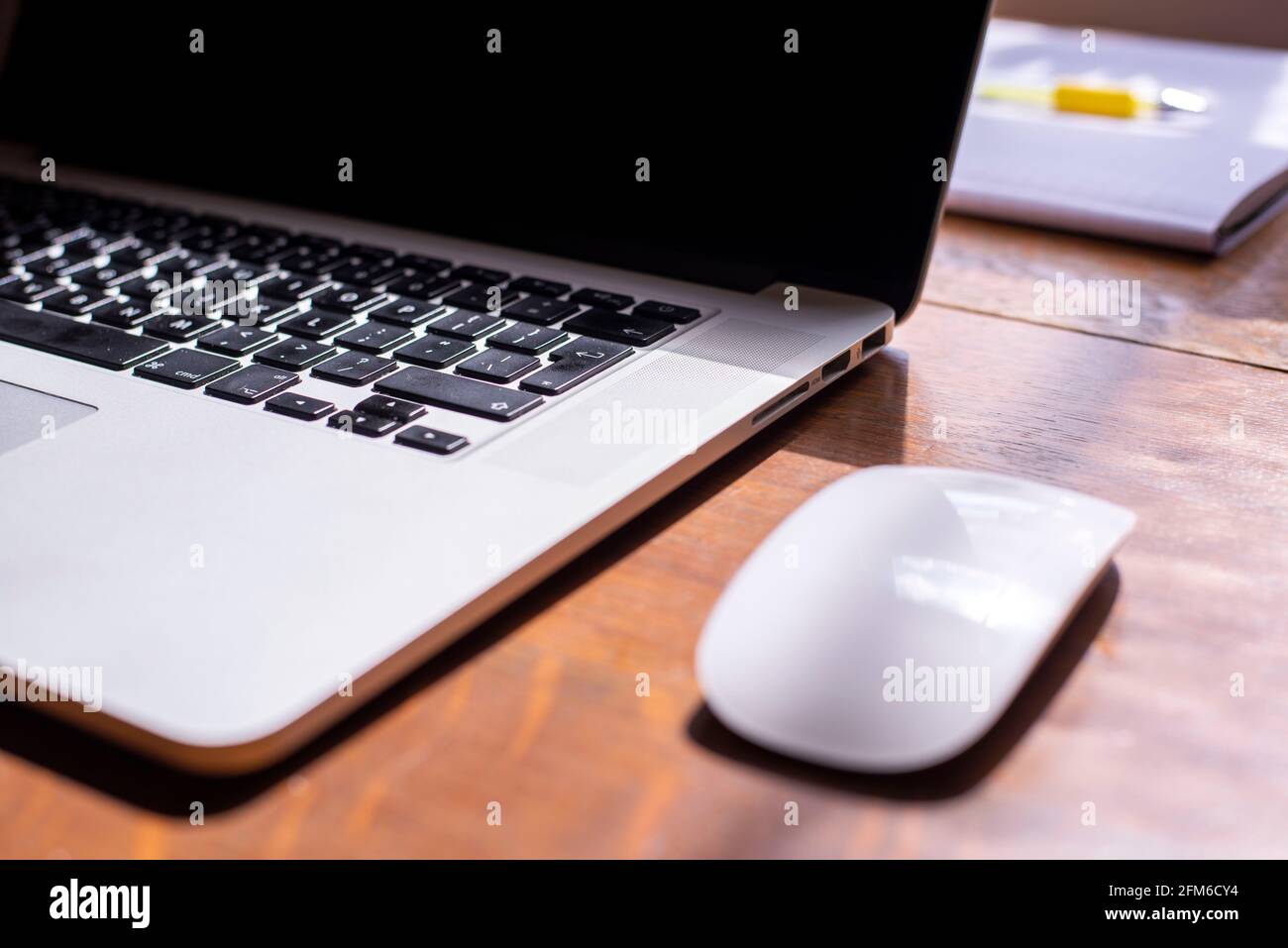 notebook with a mouse on a table Stock Photo