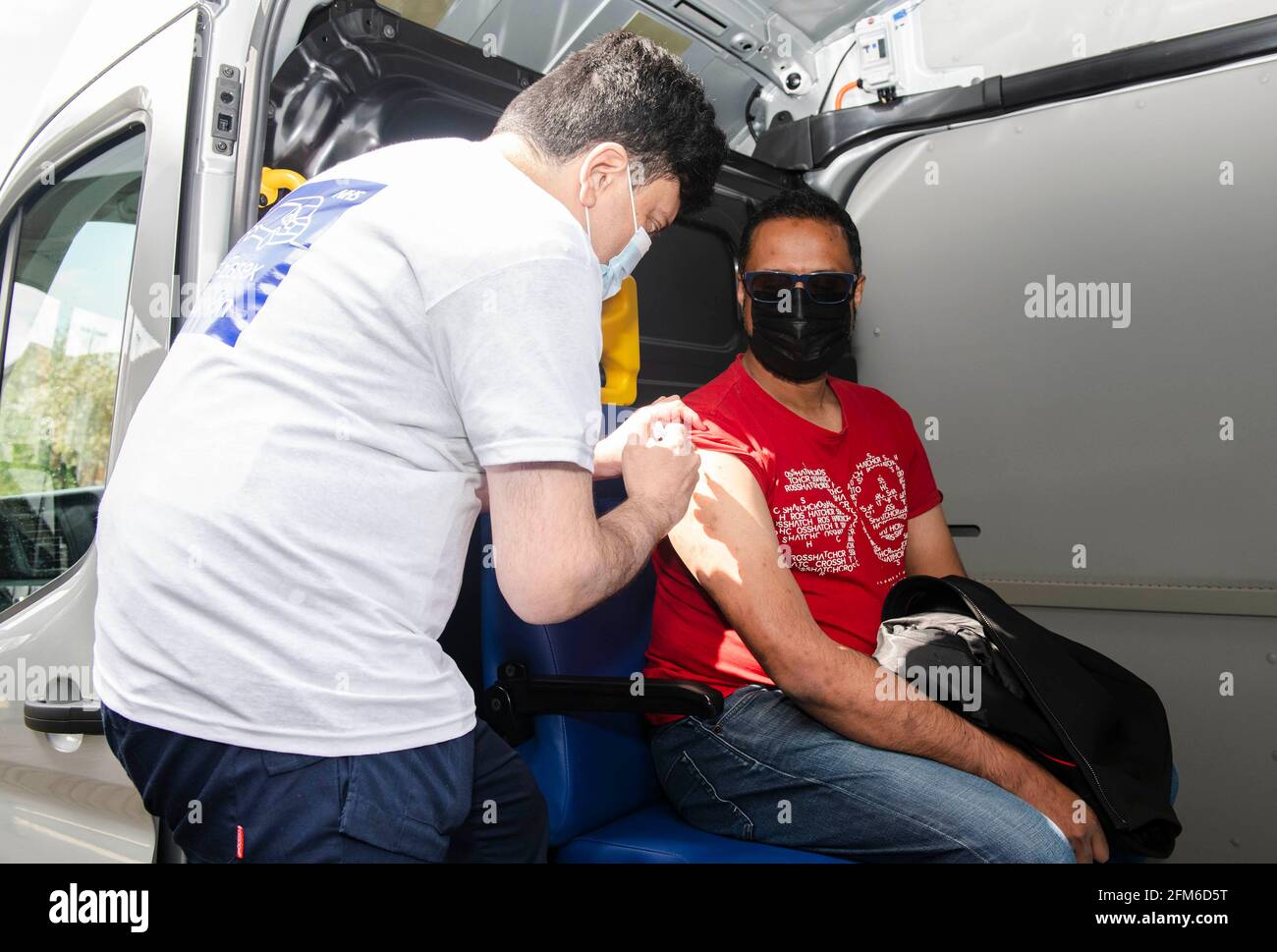 EDITORIAL USE ONLY Ahsan Raja, receives the Oxford/AstraZeneca Covid-19 ...