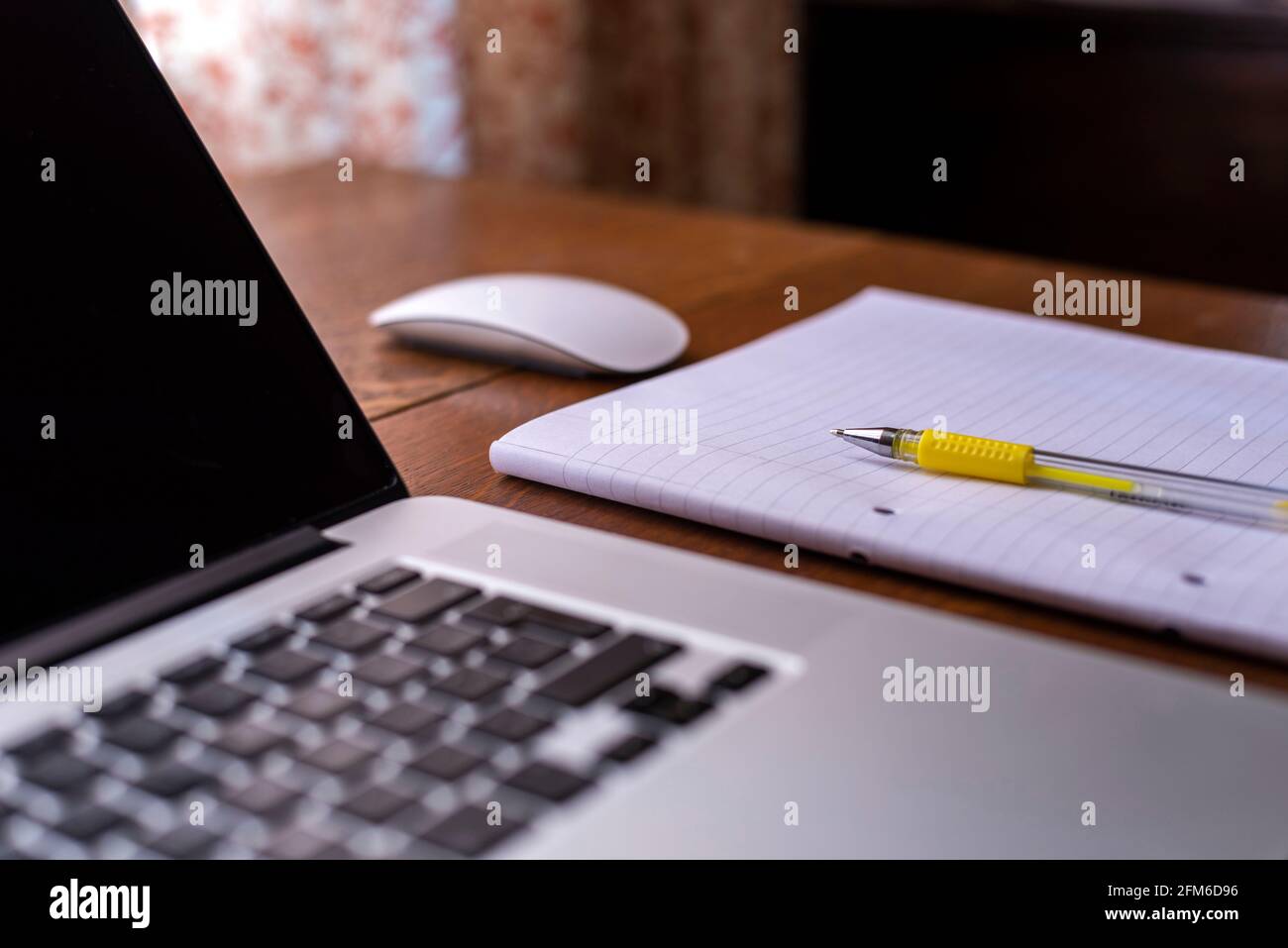 notebook with a mouse on a table Stock Photo