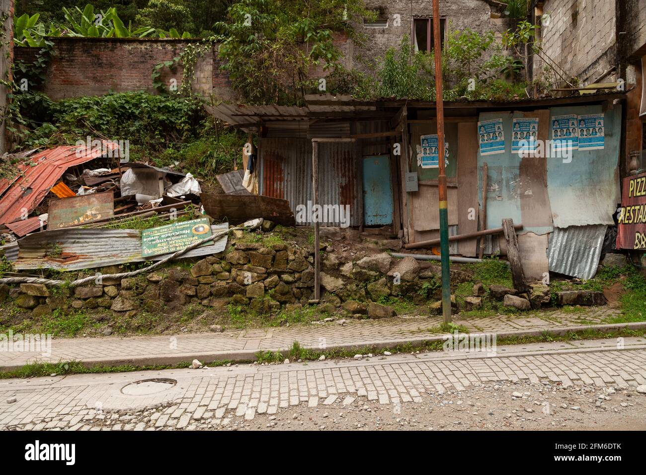 Aguas Calientes, Peru - April 06, 2014: Neighborhood of old and abandoned houses, on the outskirts of the municipality of Aguas Calientes, near the Ur Stock Photo