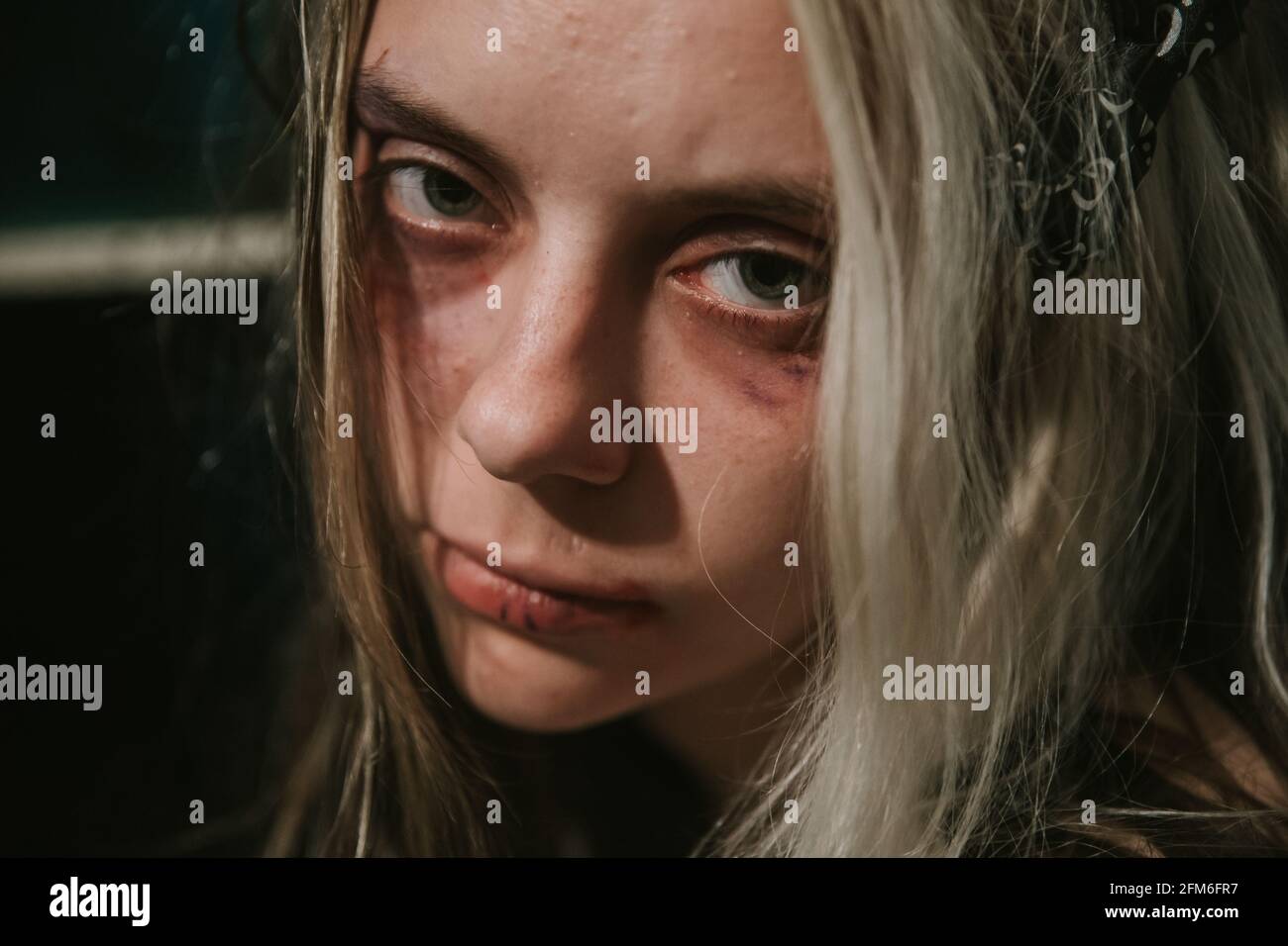 close-up portrait of frightened abused young woman Stock Photo