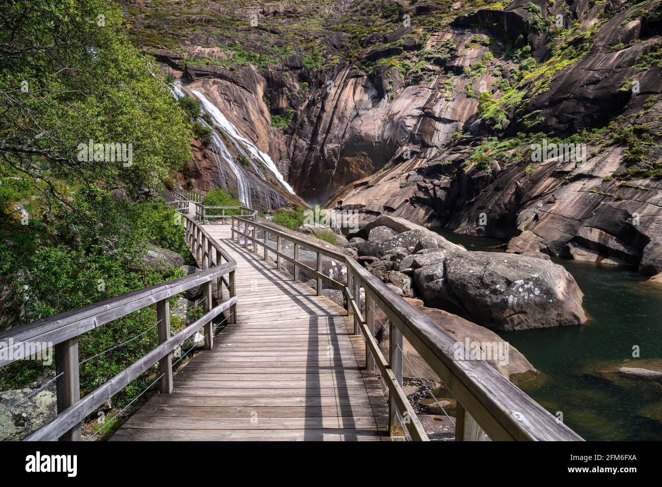 Wooden footbridge to the famous Ezaro waterfall. Galicia, Spain. Stock Photo